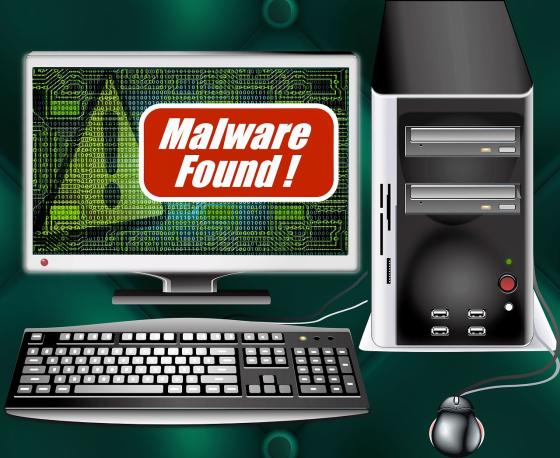 A computer set up with the warning Malware found!
