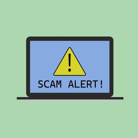 Laptop showing Scam Alert warning