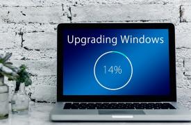 A laptop showing a Windows update at 14 per cent