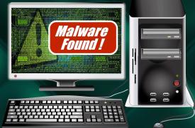 A computer set up with the warning Malware found!