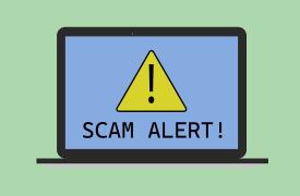 Laptop showing Scam Alert warning